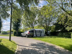 touring caravan under trees