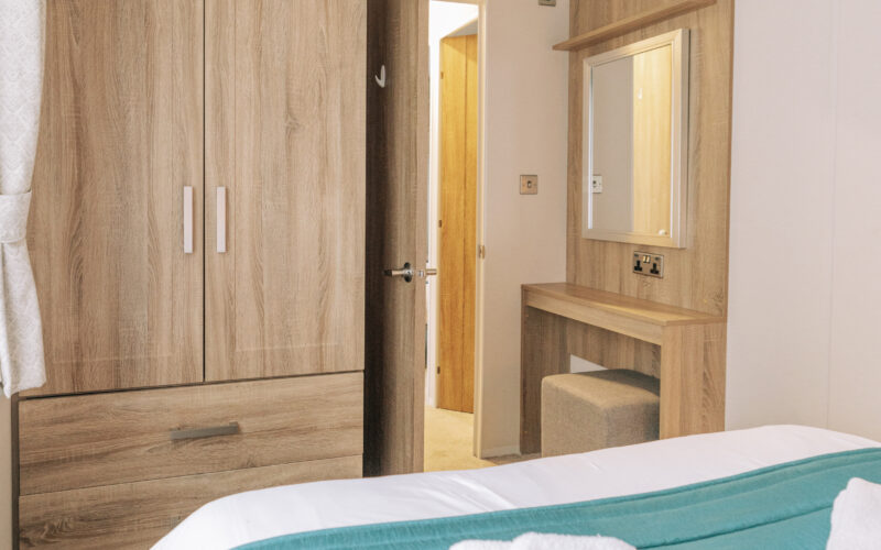Oak holiday home master bedroom storage